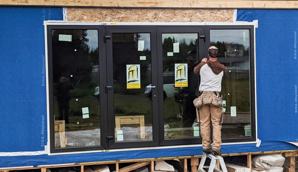 Euroline Windows, a window manufacturer based out of Vancouver, BC, Installing a Window on a Lotus Modular Home in Surrey, BC.