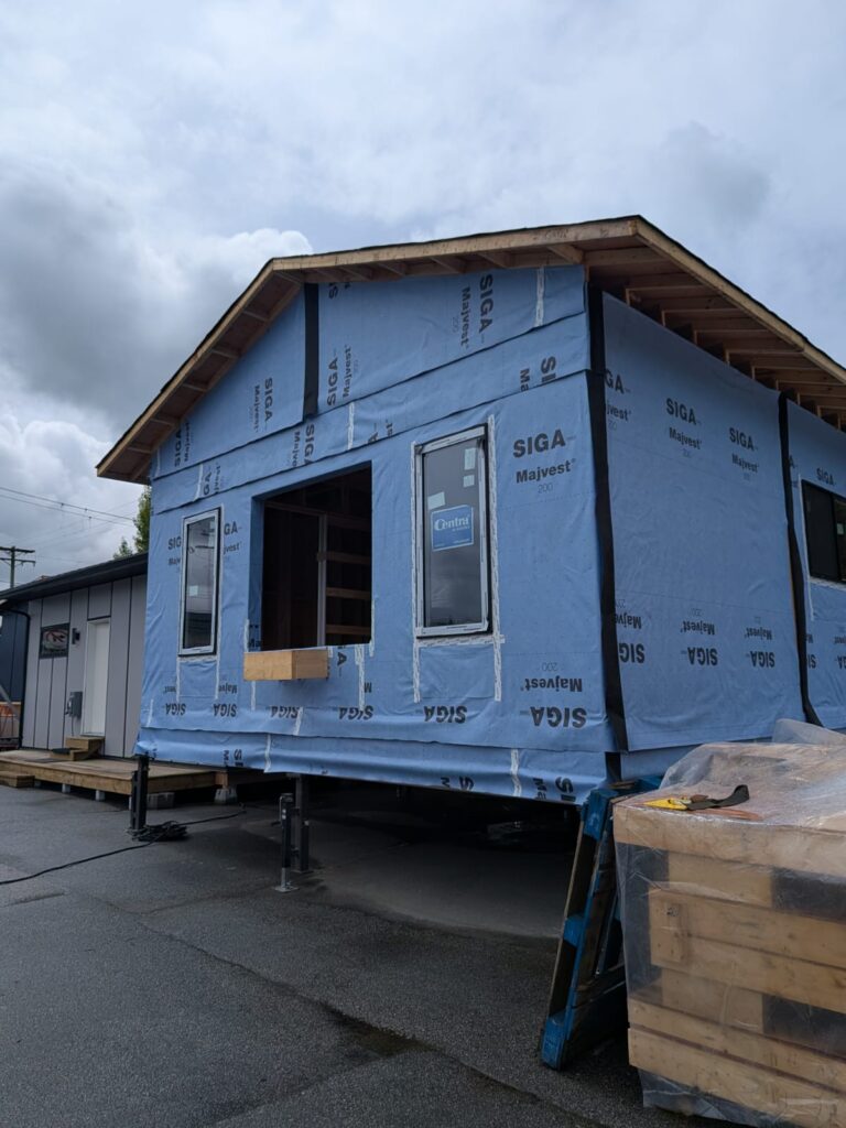 Exterior of Surrey intergenerational home with open space for window install.